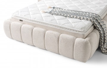 Boxspring japandi opbergbed  luxe zachte stof licht creme detail